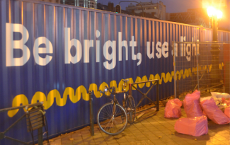 ©Barry Sandland/TIMB - Cycling advocacy groups set up a part of containers as as tunnel for their Be Bright Use a Light campaign